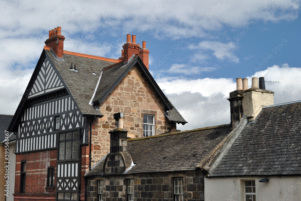 Naklejka premium Old Half Timbered Building & Slate Roofs against Blue Sky 