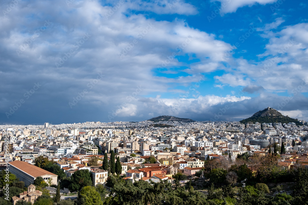 Mount Lycabettus and Athens cityscape view from Areopagus hill in Greece, blue cloudy sky