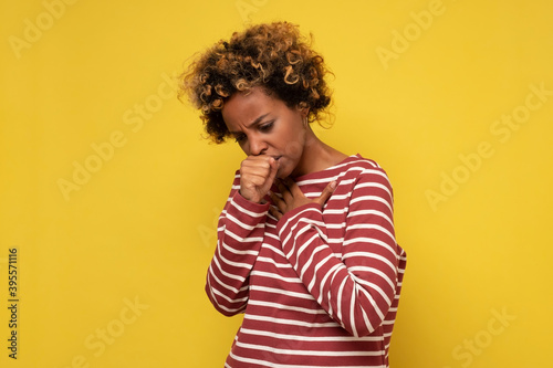 Obraz na plátně African american woman feeling unwell and coughing as symptom for cold or bronchitis