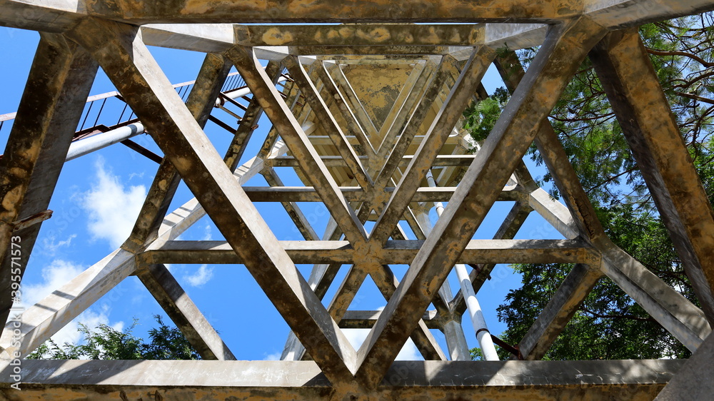 Structure of the water tank column. In the bottom view of a columnar structure made of cement and a pipe of a large water tank in the water supply system. Selective focus
Structure of the water tank column. In the bottom view of a columnar structure made of cement and a pipe of a large water tank in the water supply system. Selective focus