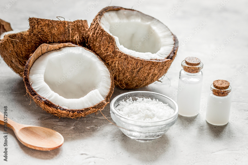 cosmetic concept with fresh coconuts on white table background cosmetic concept with fresh coconuts on white table background