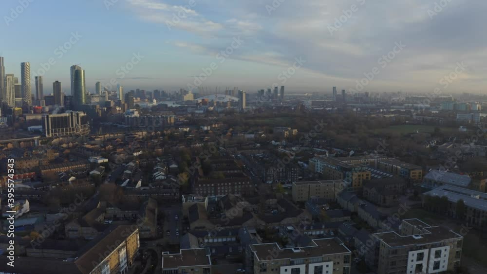 Dolly forward drone shot towards O2 arena over Isle of Dogs at sunrise London Dolly forward drone shot towards O2 arena over Isle of Dogs at sunrise London