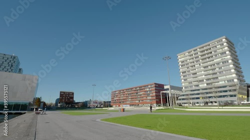 Wallpaper Mural Newly renovated Esplanade square in the center of Almere (The Netherlands) during the day with few people walking due to a partial COVID-19 lockdown in November 2020. Static extreme long shot.  Torontodigital.ca