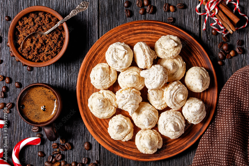 Meringue cookies on a dark wooden background