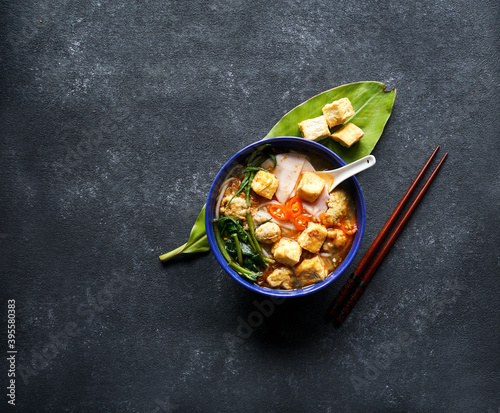 Canh bun - Vietnamese noodle soup with water spinach, fried tofu and fish balls photo