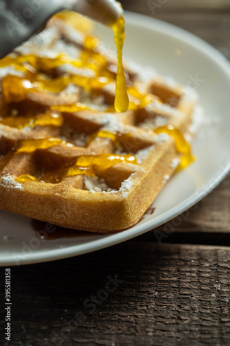 Homemade Belgium wafers with topping and sugar filling