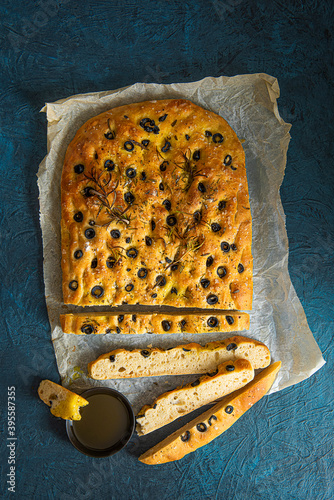 Homemeade olive oil and black olive foccacia with rosemary photo