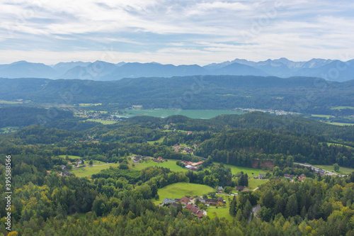Fototapeta Naklejka Na Ścianę i Meble -  Charming village surrounded by mountains, view from The Pyramidenkogel, the highest wooden viewing tower in the world, famous tourists attraction at the lake Worthersee, Carinthia region, Austria