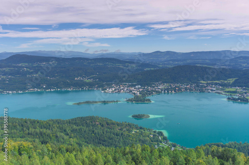 Aerial view with the alpine lake Worthersee from The Pyramidenkogel, the highest wooden viewing tower in the world, famous tourists attraction in Carinthia region, Austria
