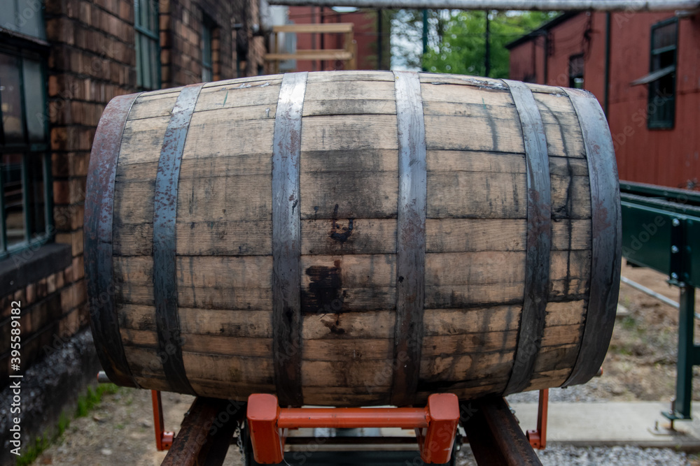 Orange Lift Holds Bourbon Barrel