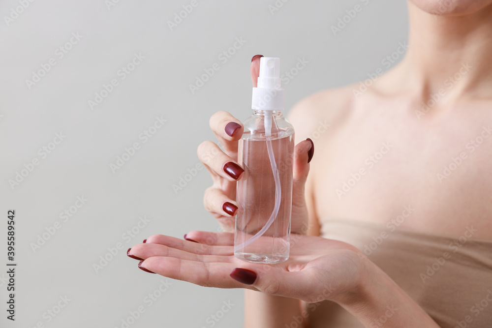 Studio beauty portrait of a young, healthy, beautiful, fresh skinned caucasian woman on a grey background Studio beauty portrait of a young, healthy, beautiful, fresh skinned caucasian woman on a grey background