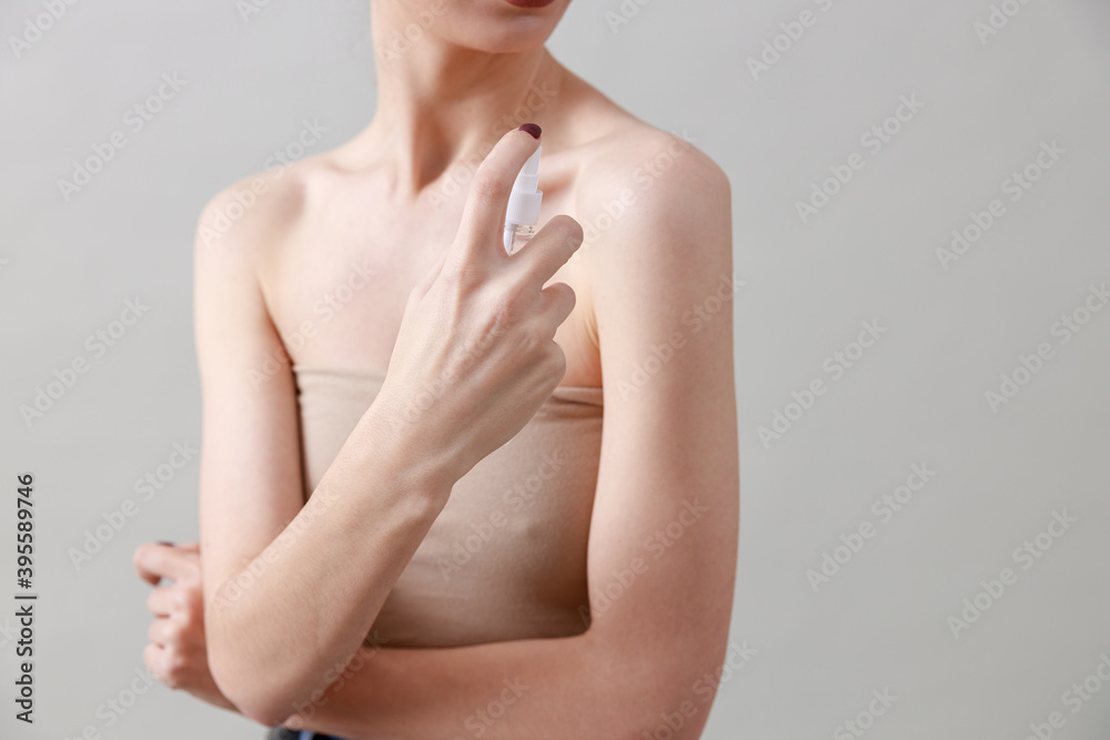 Studio beauty portrait of a young, healthy, beautiful, fresh skinned caucasian woman on a grey background Studio beauty portrait of a young, healthy, beautiful, fresh skinned caucasian woman on a grey background