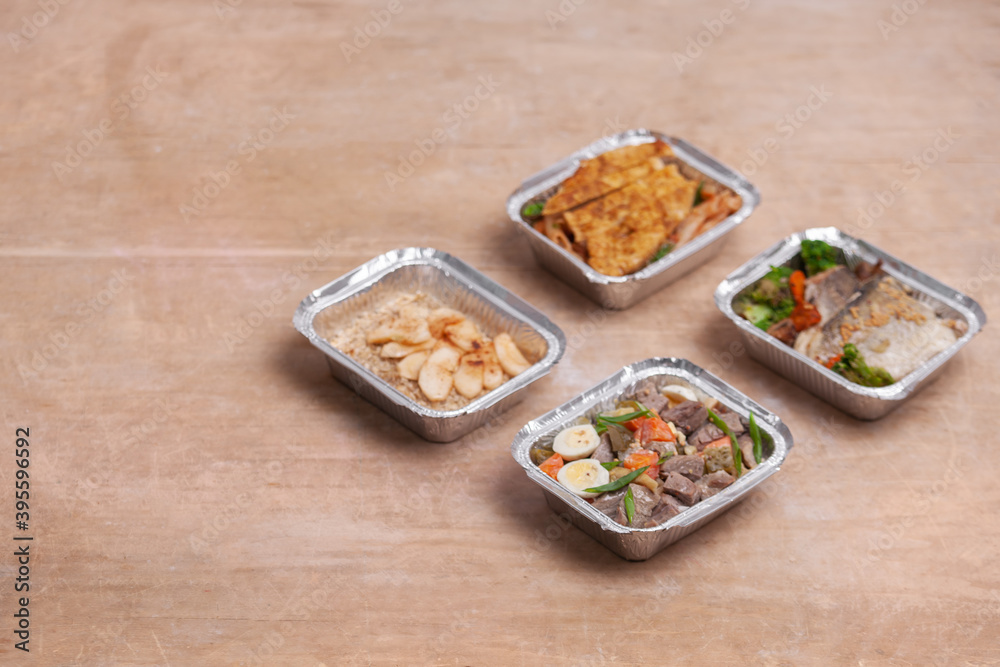 take away lunch boxes with fresh meal in foil container or healthy food delivery take away lunch boxes with fresh meal in foil container or healthy food delivery