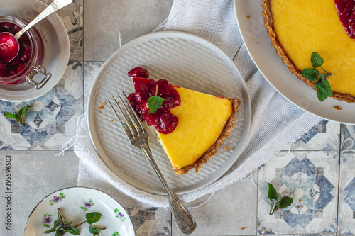 Ricotta pie with sour cherries sauce