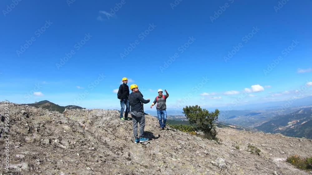 Mineral del Chico- Hidalgo México - November 01, 2020: High angle shot of male rock climbers standing on a mountain Mineral del Chico- Hidalgo México - November 01, 2020: High angle shot of male rock climbers standing on a mountain
