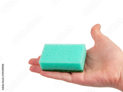 Sponge for washing dishes in hand isolated on the white