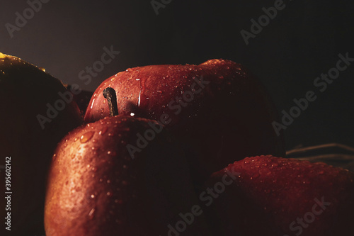 
Christmas background atmospheric photo of apples with honey on a dark background with lollipop