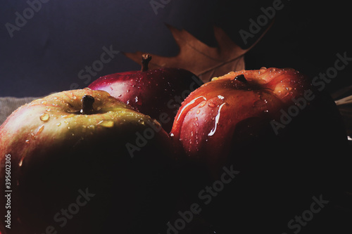 
Christmas background atmospheric photo of apples with honey on a dark background with lollipop