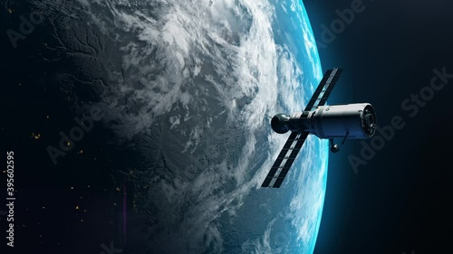 artificial satellite of the earth. a satellite flying in space over the globe photo