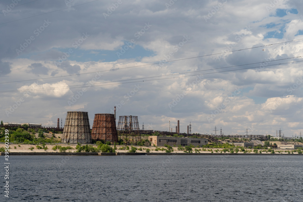 Naklejka premium Volgograd, Russia, July 22, 2020, Volgograd Krasnooktyabrsky district red October combine tractor plant factory pipes