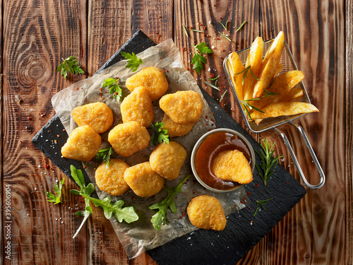 Chicken nuggets with potato wedges photo