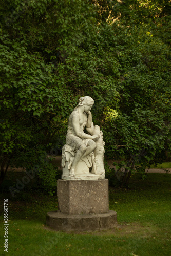 statue of a person in a garden