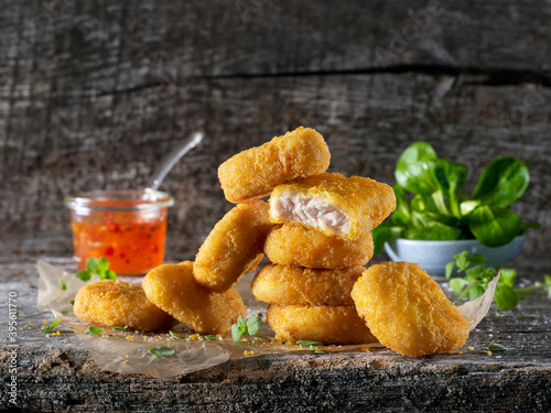 Chicken nuggets with lamb's lettuce and dip photo