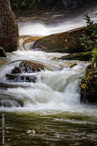 Small cascades flow at the bottom of Glen Cannon falls in North Carolina