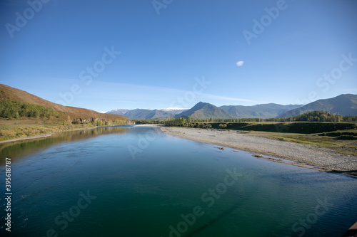 Scenic image of fairy-tale Landscape with colorful overcast sky under sunlit  over the Mountain Lake. Megical Natural Background. Amazing lake in sunset. Creative image. Strbske Pleso. Slovakia. Tatra