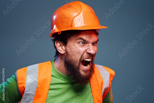 Emotional builders orange hard hat safety work fatigue blue background © SHOTPRIME STUDIO
