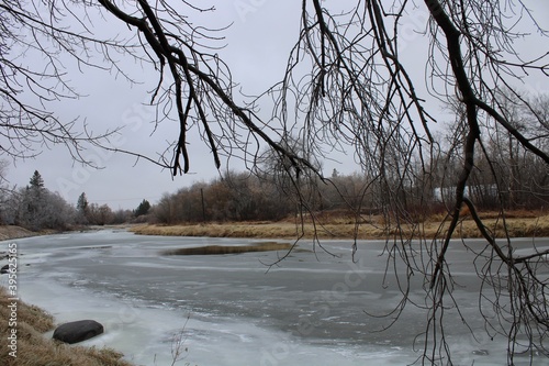 River in winter

Ice is water in its frozen, solid form... Water will freeze at zero degrees Celsius (32 degrees Fahrenheit). Once it gets close to its freezing point, water molecules begin to expand.