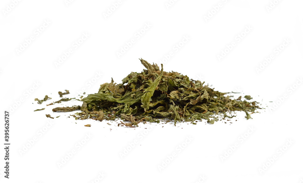 Dried mint herb isolated on white background. A handful of dried mint leaves. Dried mint herb isolated on white background. A handful of dried mint leaves.