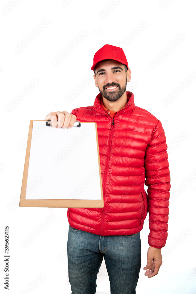 Delivery man giving the clipboard to a client to sign. Delivery man giving the clipboard to a client to sign.