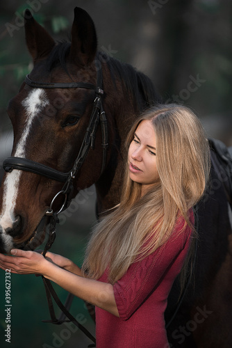 woman with horse in dark forest