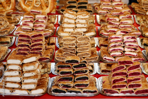 Various flavor strudel for sale in pastry shop photo