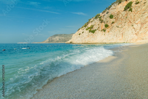 Fototapeta Naklejka Na Ścianę i Meble -  Kaputas beach, Turkey. Beautiful turquoise beach with sun in a Turkish resort in summer