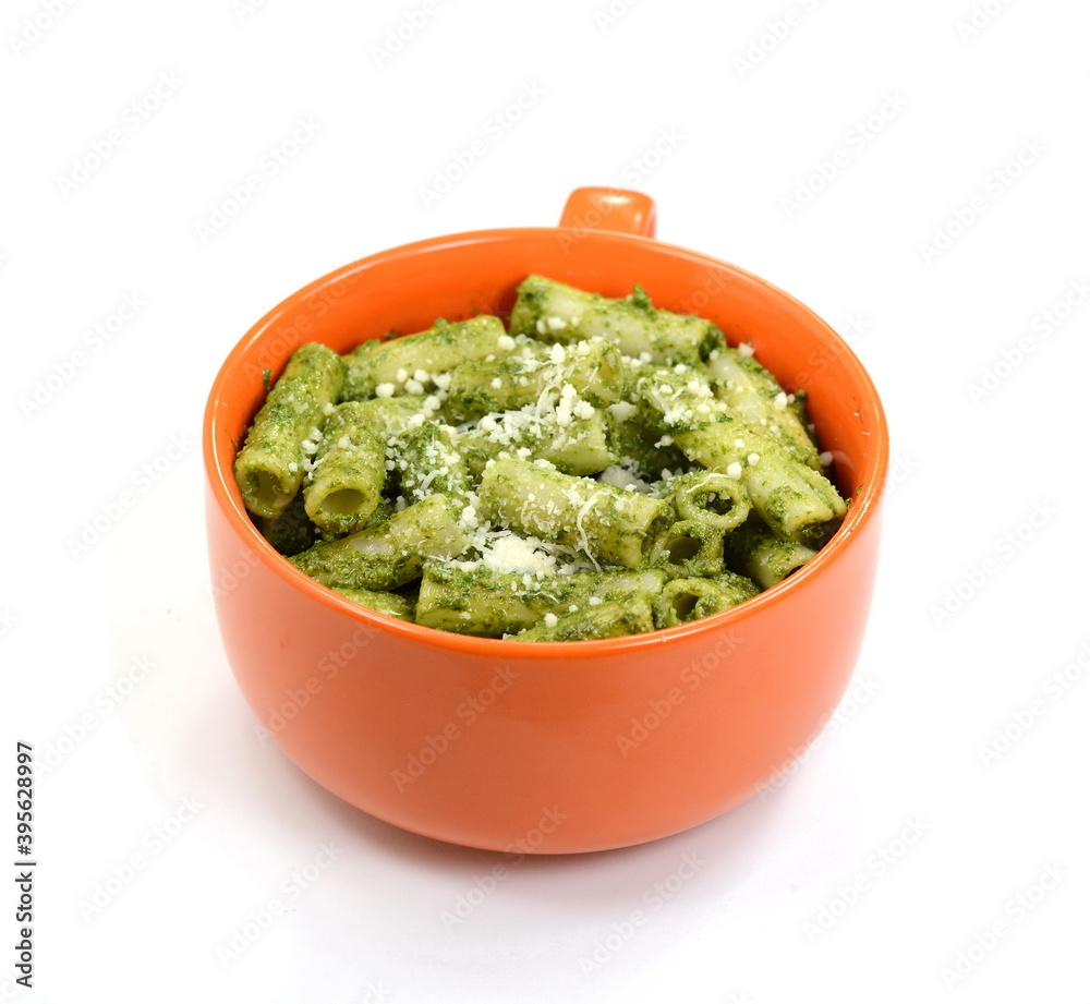 Pasta with original pesto green sauce in Genoa (Genova) Italy on white background, Pasta with basil pesto herbs isolated. Italian Food. Pasta with original pesto green sauce in Genoa (Genova) Italy on white background, Pasta with basil pesto herbs isolated. Italian Food.