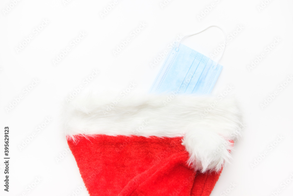 Protective mask hidden in a Santa Claus hat Protective mask hidden in a Santa Claus hat