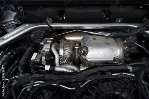 The turbocharger is installed on the engine of a modern powerful car.