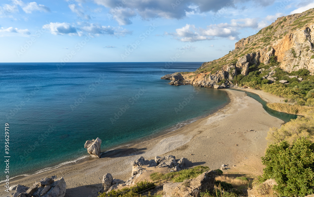 Preveli beach (aka., Palm Beach) at the mouth of the Megas river flowing through a gorgeous palm tree glade along the Kourtaliotiko gorge, Southern Crete, Greece