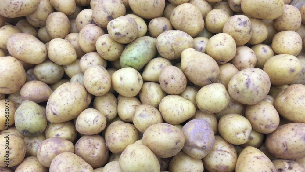 Potatoes are on sale in supermarket, close up view as a background Potatoes are on sale in supermarket, close up view as a background