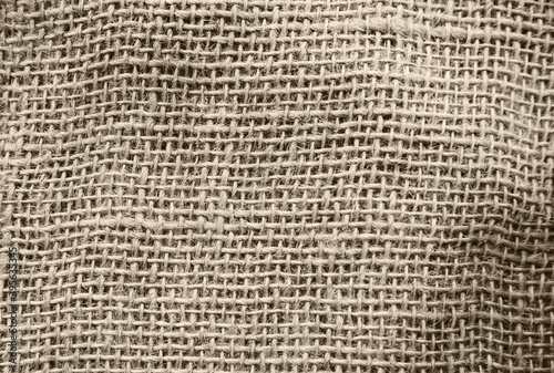 Burlap fabric, cotton fabric close-up beige and brown, with space for text.The texture of the fabric.