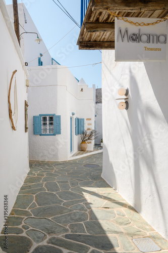 Folegandros, Greece - September 23, 2020: Cobbled street with white Cycladic architecture in Chora on Folegandros. Cyclades Islands, Greece © vivoo
