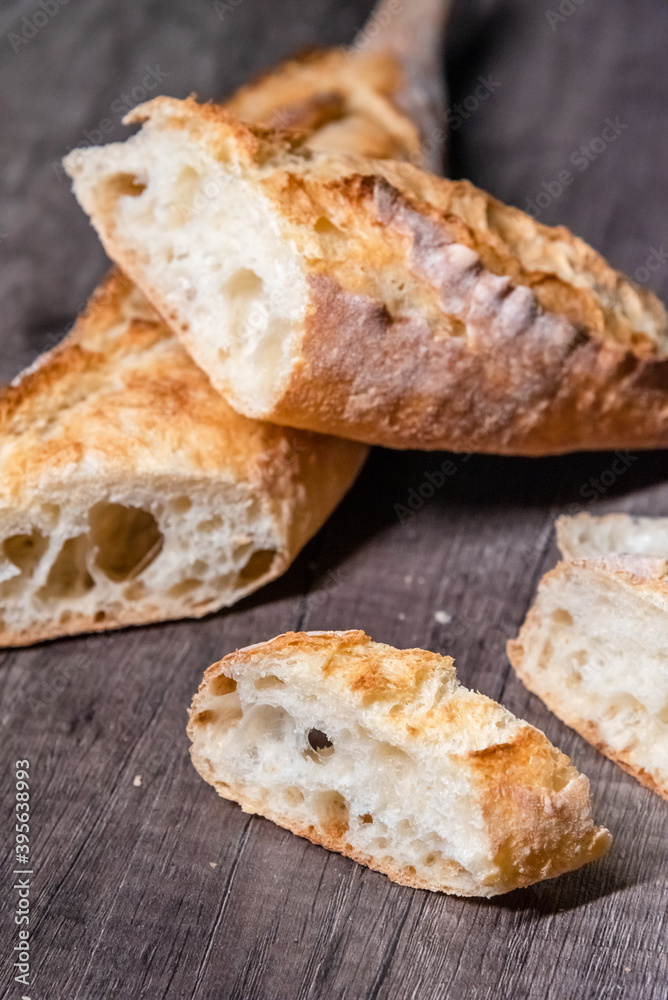 Various rustic bread on a wooden board. Healthy food and farming concept Various rustic bread on a wooden board. Healthy food and farming concept