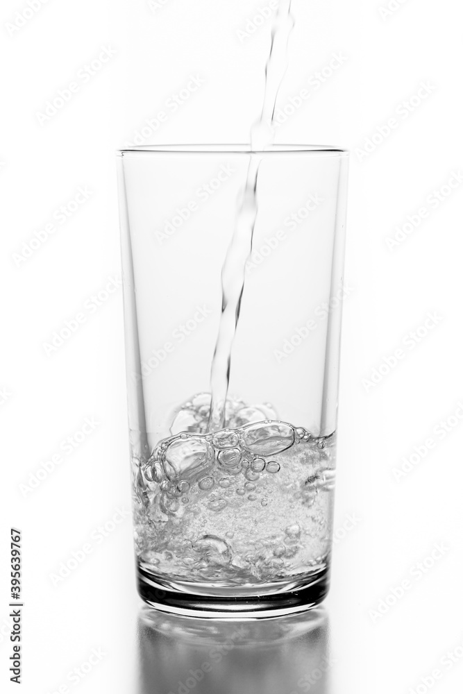 Pouring sparkling water into a glass. A container for storing liquids. Pouring sparkling water into a glass. A container for storing liquids.