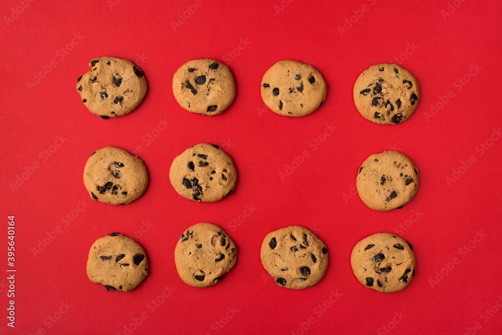 Obraz premium Sweet chocolate cookies concept. Top flatlay close up view photo of set of biscuits with one empty space isolated over light color background