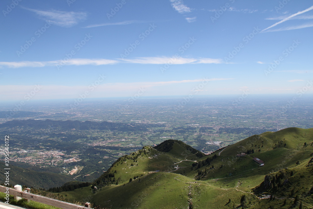 the view from the mountains, from the hills and meadows to the lowland below with the towns