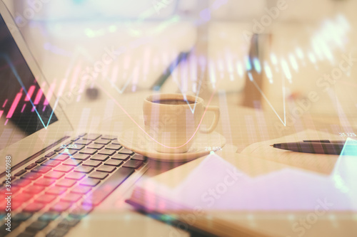 Double exposure of financial chart drawing and desktop with coffee and items on table background. Concept of forex market trading