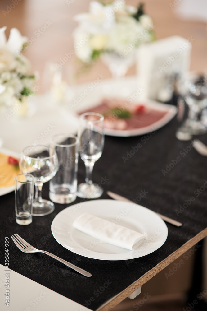 Table set for an event party or wedding reception. Table set for an event party or wedding reception.