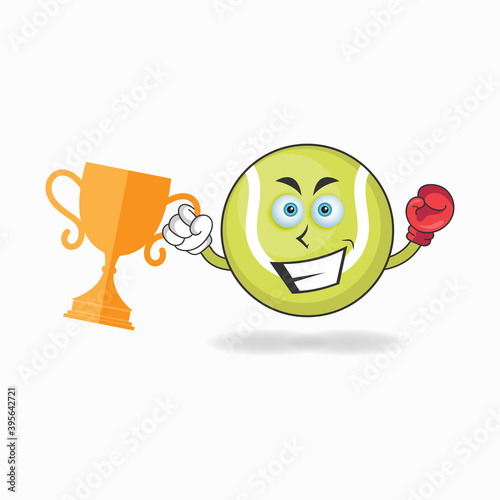 The Tennis ball mascot character wins a boxing trophy. vector illustration